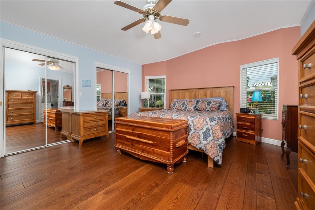 706 Starboard Avenue Edgewater, FL 32141 - Photo 14 of 35 a bedroom with a bed and wooden floor