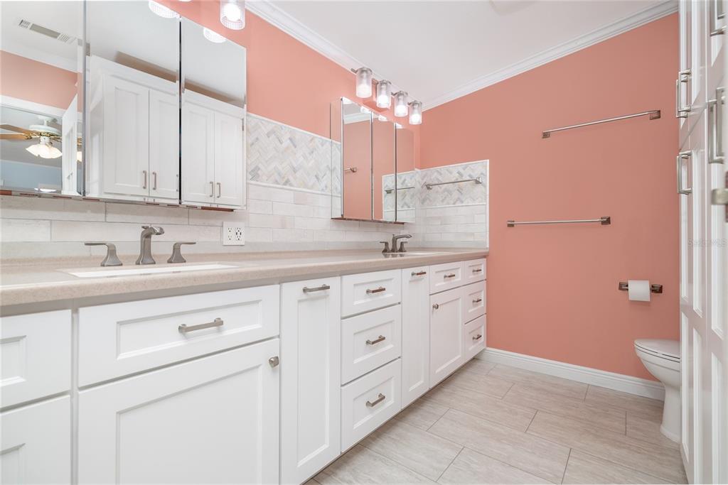 706 Starboard Avenue Edgewater, FL 32141 - Photo 16 of 35 a bathroom with a granite countertop sink a toilet and mirror