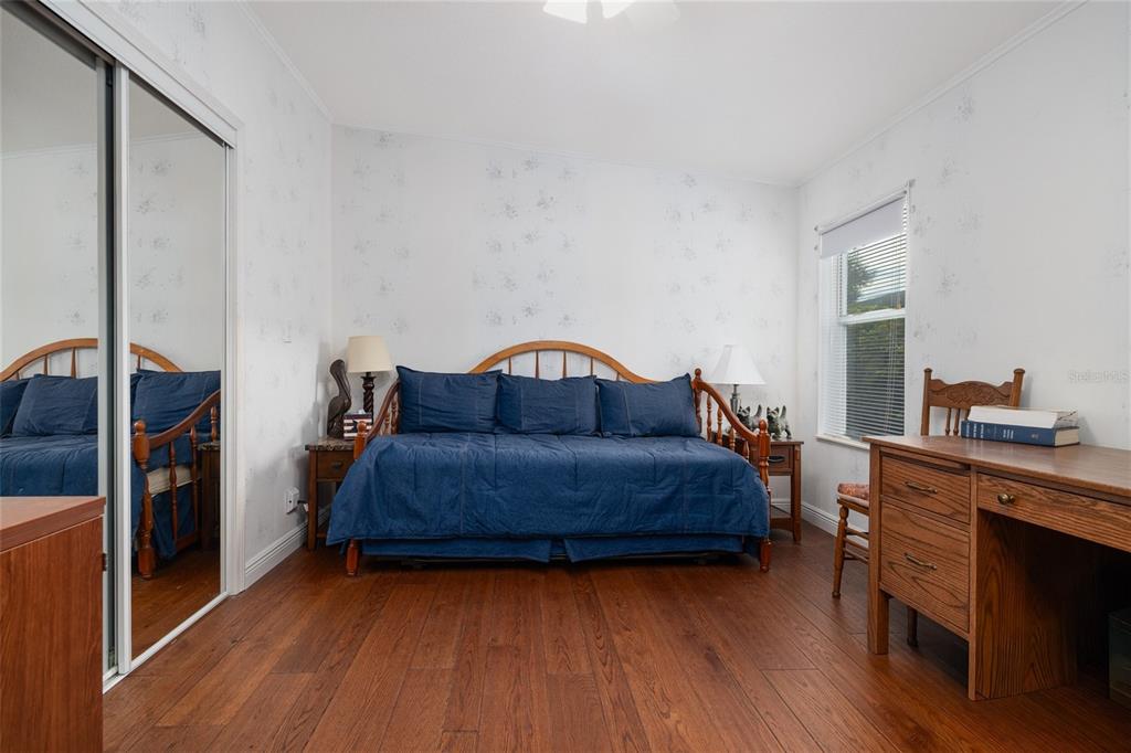 706 Starboard Avenue Edgewater, FL 32141 - Photo 19 of 35 a living room with a bed furniture and a flat screen tv