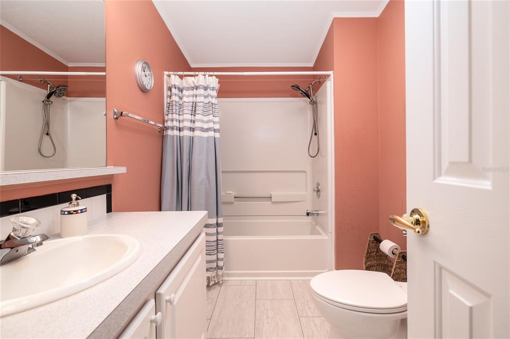 706 Starboard Avenue Edgewater, FL 32141 - Photo 20 of 35 a bathroom with a sink a toilet and shower