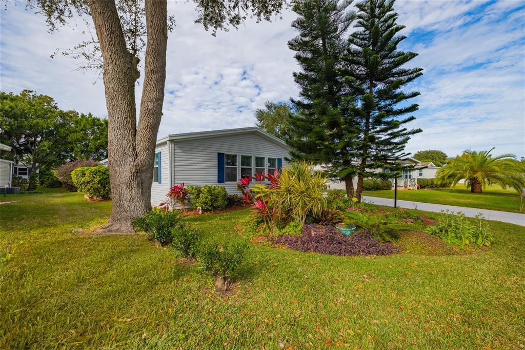 706 Starboard Avenue Edgewater, FL 32141 - Photo 3 of 35 a front view of a house with garden