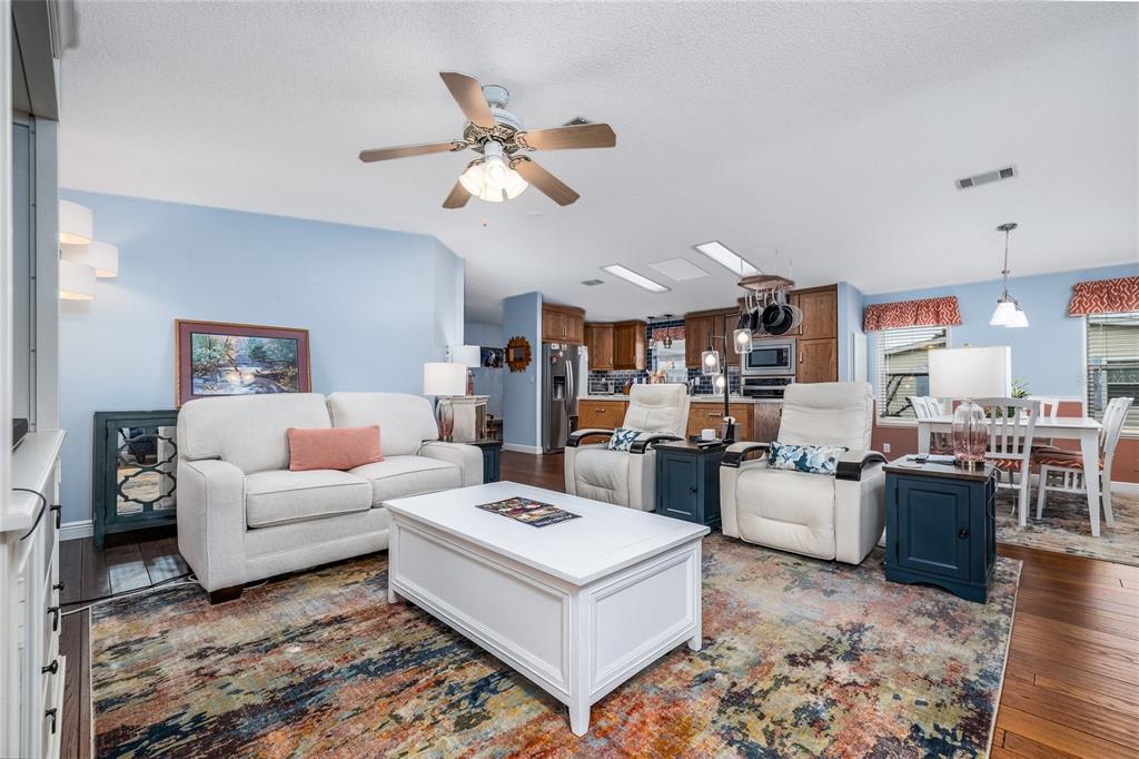 706 Starboard Avenue Edgewater, FL 32141 - Photo 6 of 35 a living room with furniture and kitchen view