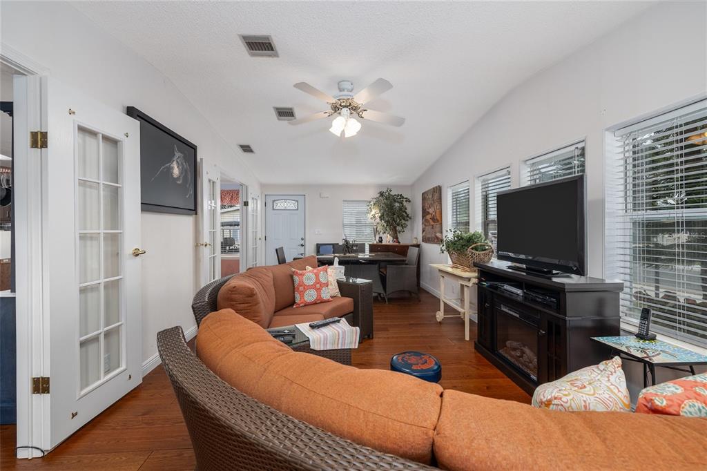 706 Starboard Avenue Edgewater, FL 32141 - Photo 8 of 35 a living room with furniture and a flat screen tv