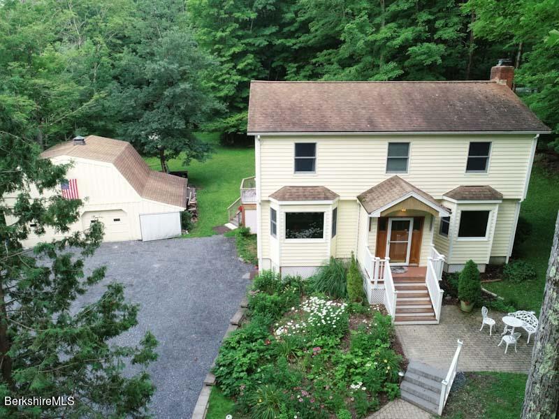 488 Summit Road Richmond, MA 01254 - Photo 2 of 44 a front view of a house with a yard and trees