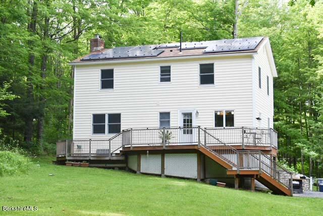 488 Summit Road Richmond, MA 01254 - Photo 18 of 44 a view of a house with a backyard