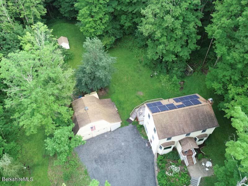 488 Summit Road Richmond, MA 01254 - Photo 3 of 44 an aerial view of a house with yard and outdoor seating