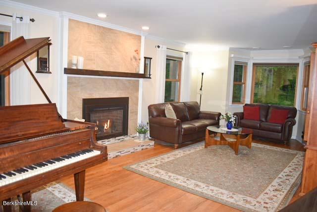 488 Summit Road Richmond, MA 01254 - Photo 23 of 44 a living room with furniture and a fireplace