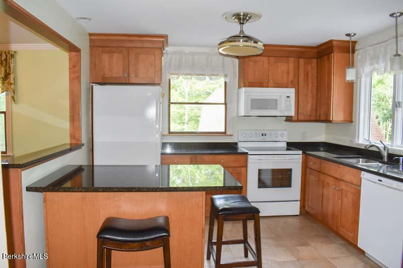 488 Summit Road Richmond, MA 01254 - Photo 27 of 44 a kitchen with stainless steel appliances a stove a sink and a microwave