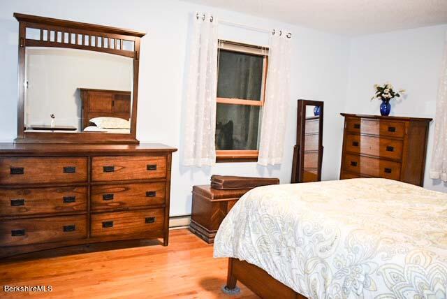 488 Summit Road Richmond, MA 01254 - Photo 37 of 44 a bedroom with a bed and a dresser