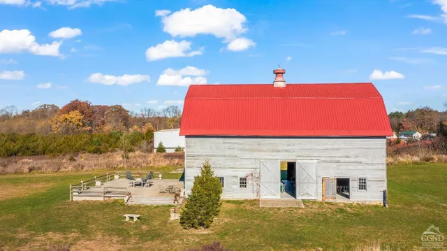 a swimming pool with outdoor seating
