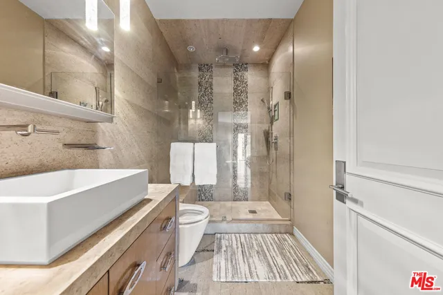 a bed room with a bed and a dresser