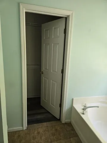 a bathroom with a tub and shower