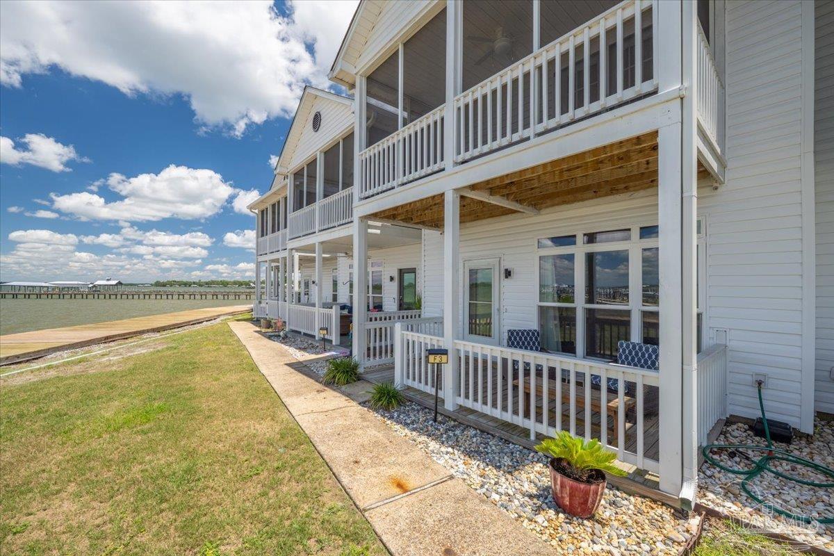 26063 Canal Road, Unit 3F Orange Beach, AL 36561 - Photo 11 of 72 a view of a house with a wooden deck