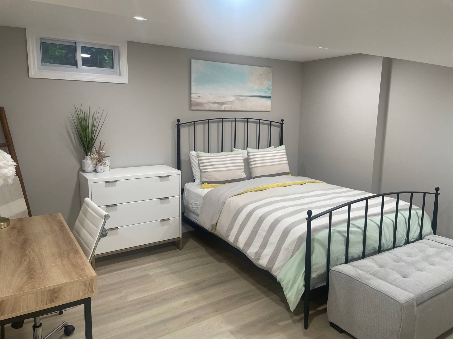 10 Scallop Avenue East Hampton, NY 11937 - Photo 12 of 23 a bedroom with a bed and a table