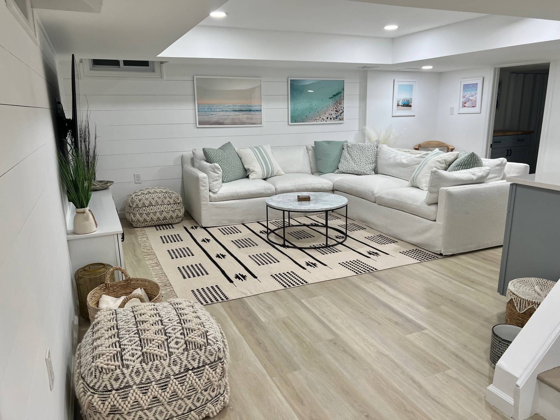 10 Scallop Avenue East Hampton, NY 11937 - Photo 13 of 23 a living room with furniture and a flat screen tv