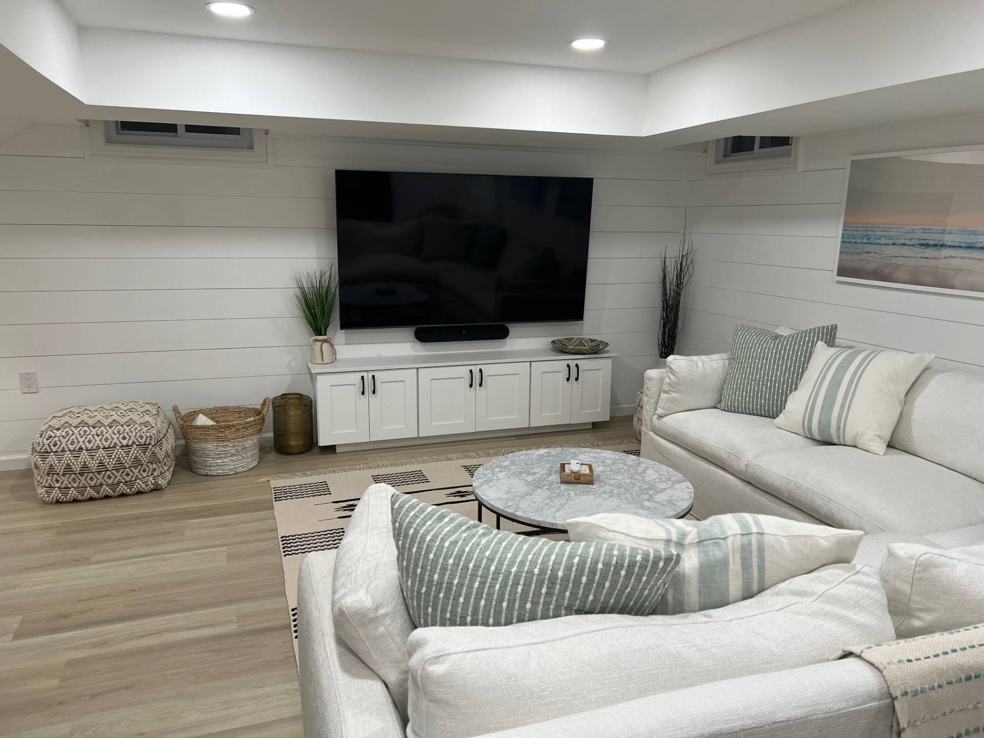 10 Scallop Avenue East Hampton, NY 11937 - Photo 14 of 23 a living room with furniture and a flat screen tv