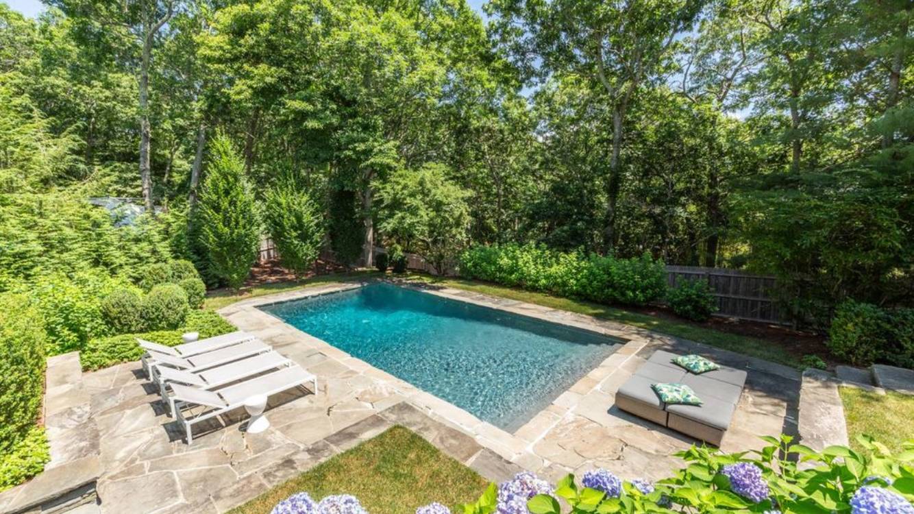 10 Scallop Avenue East Hampton, NY 11937 - Photo 20 of 23 a view of a backyard with lawn chairs