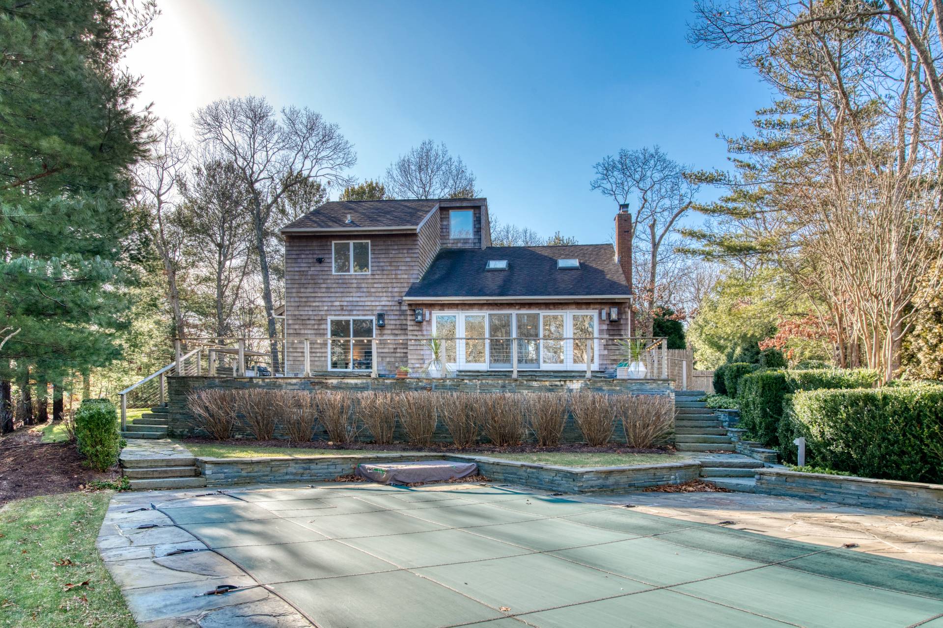 10 Scallop Avenue East Hampton, NY 11937 - Photo 21 of 23 a view of a house with a yard