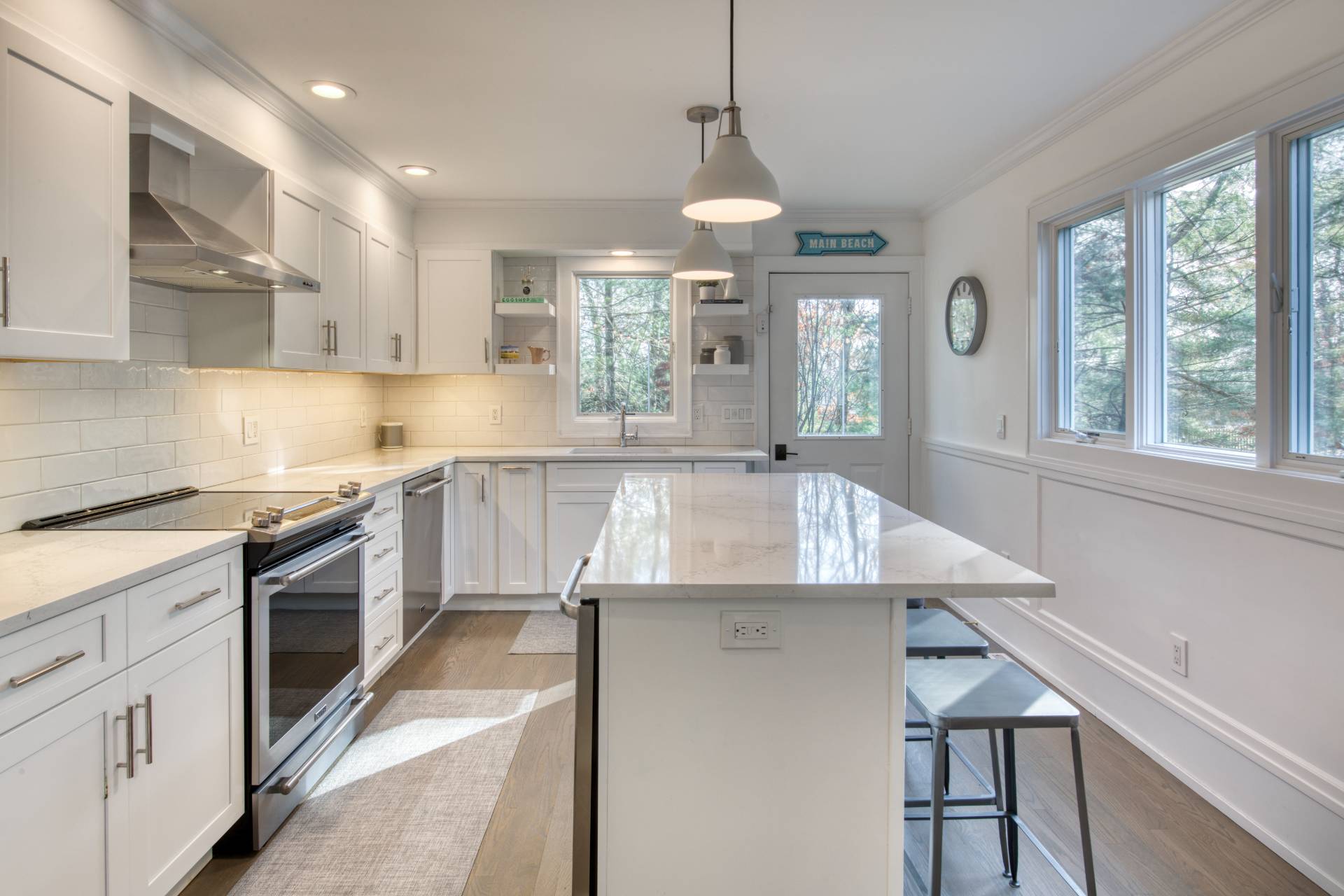 10 Scallop Avenue East Hampton, NY 11937 - Photo 5 of 23 a kitchen with a stove a sink and a refrigerator