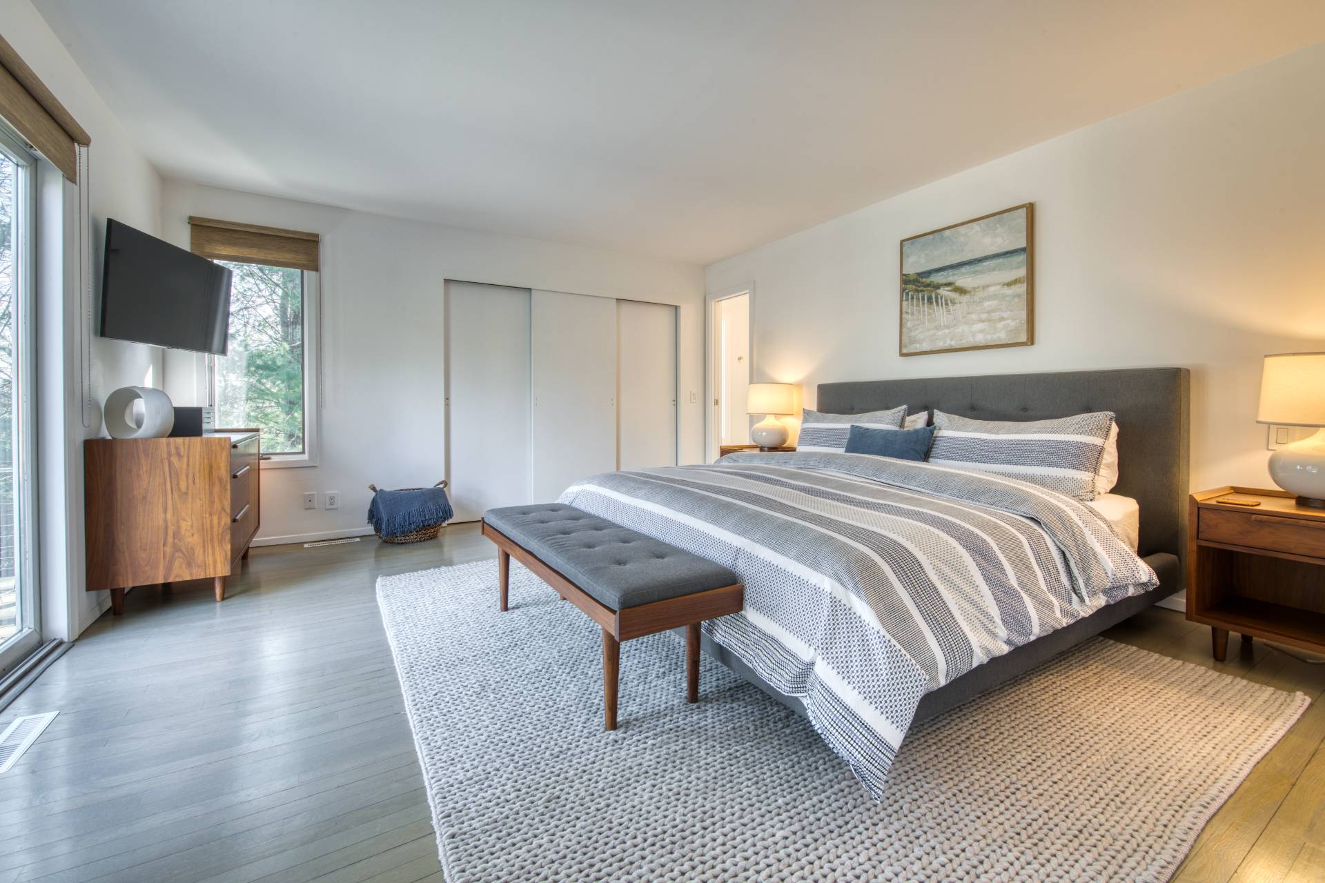 10 Scallop Avenue East Hampton, NY 11937 - Photo 7 of 23 a bedroom with a bed and wooden floor