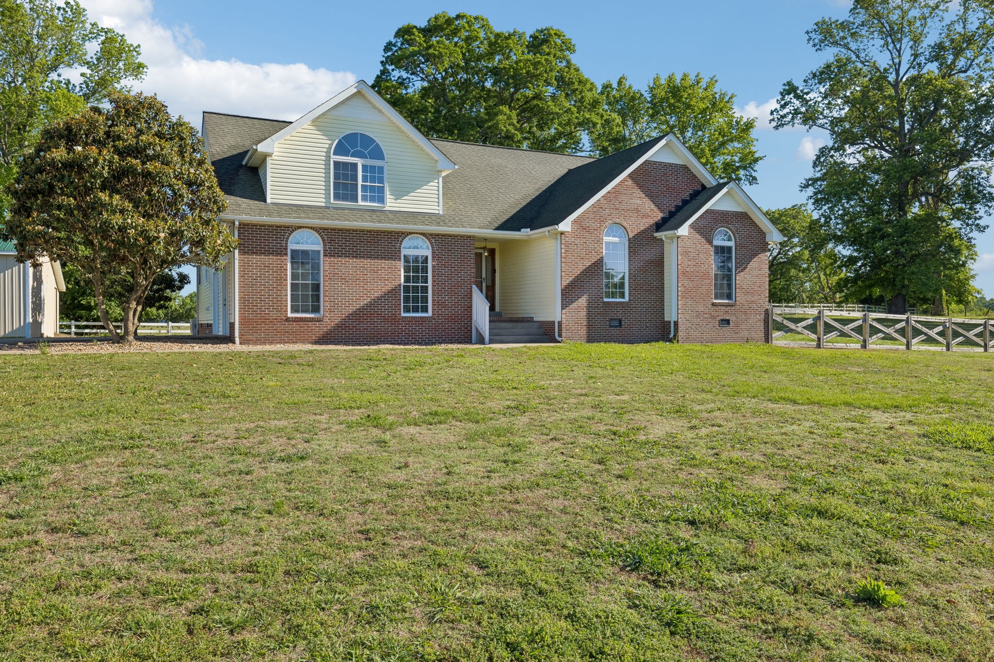 100 Heath Road Charlotte, TN 37036 - Photo 1 of 42 a front view of a house with a yard