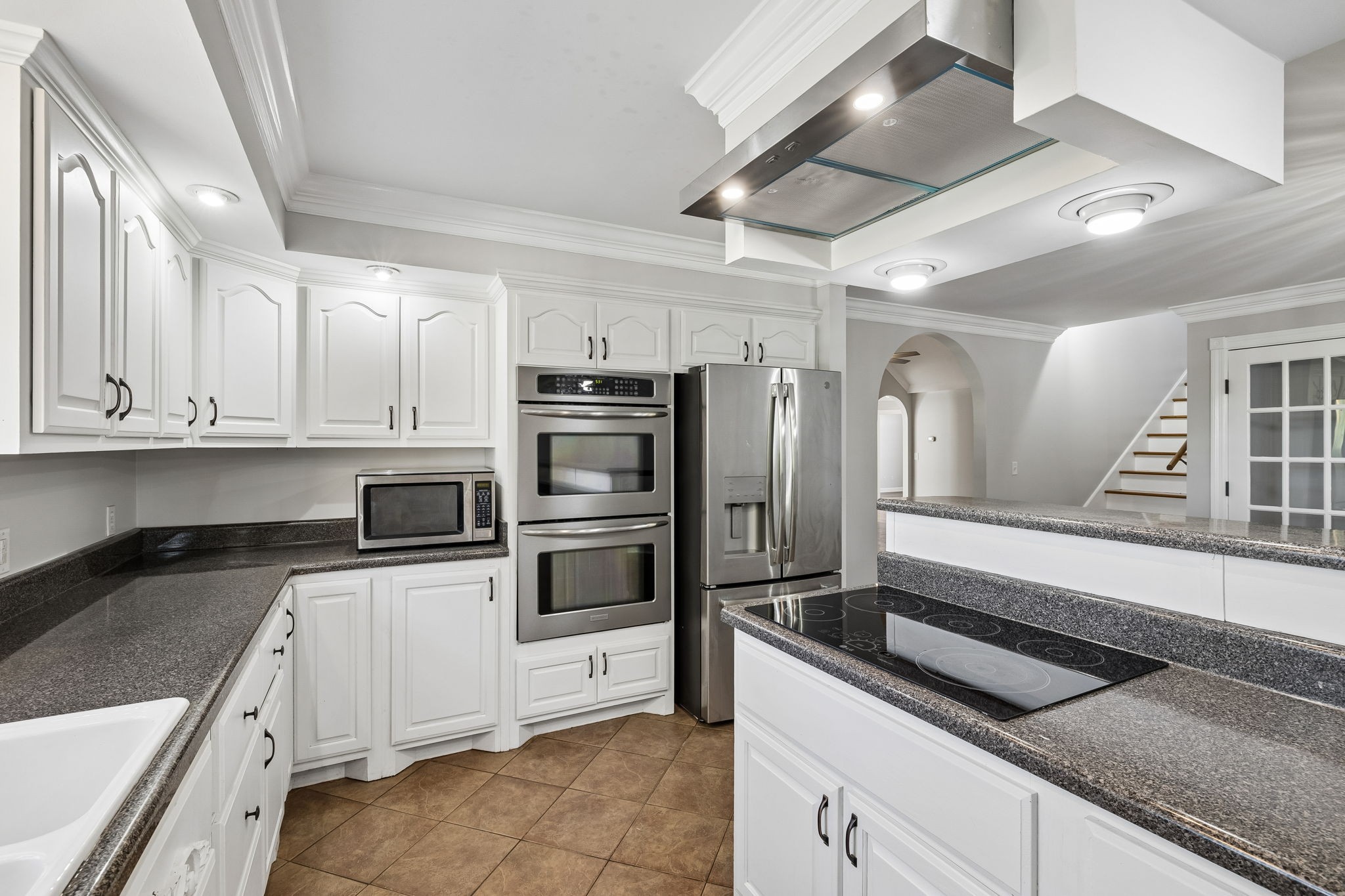 100 Heath Road Charlotte, TN 37036 - Photo 19 of 42 a kitchen with granite countertop a refrigerator and a sink