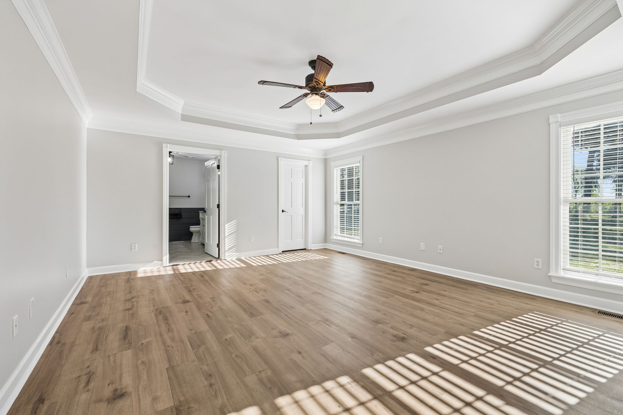 100 Heath Road Charlotte, TN 37036 - Photo 21 of 42 a view of empty room with wooden floor and fan