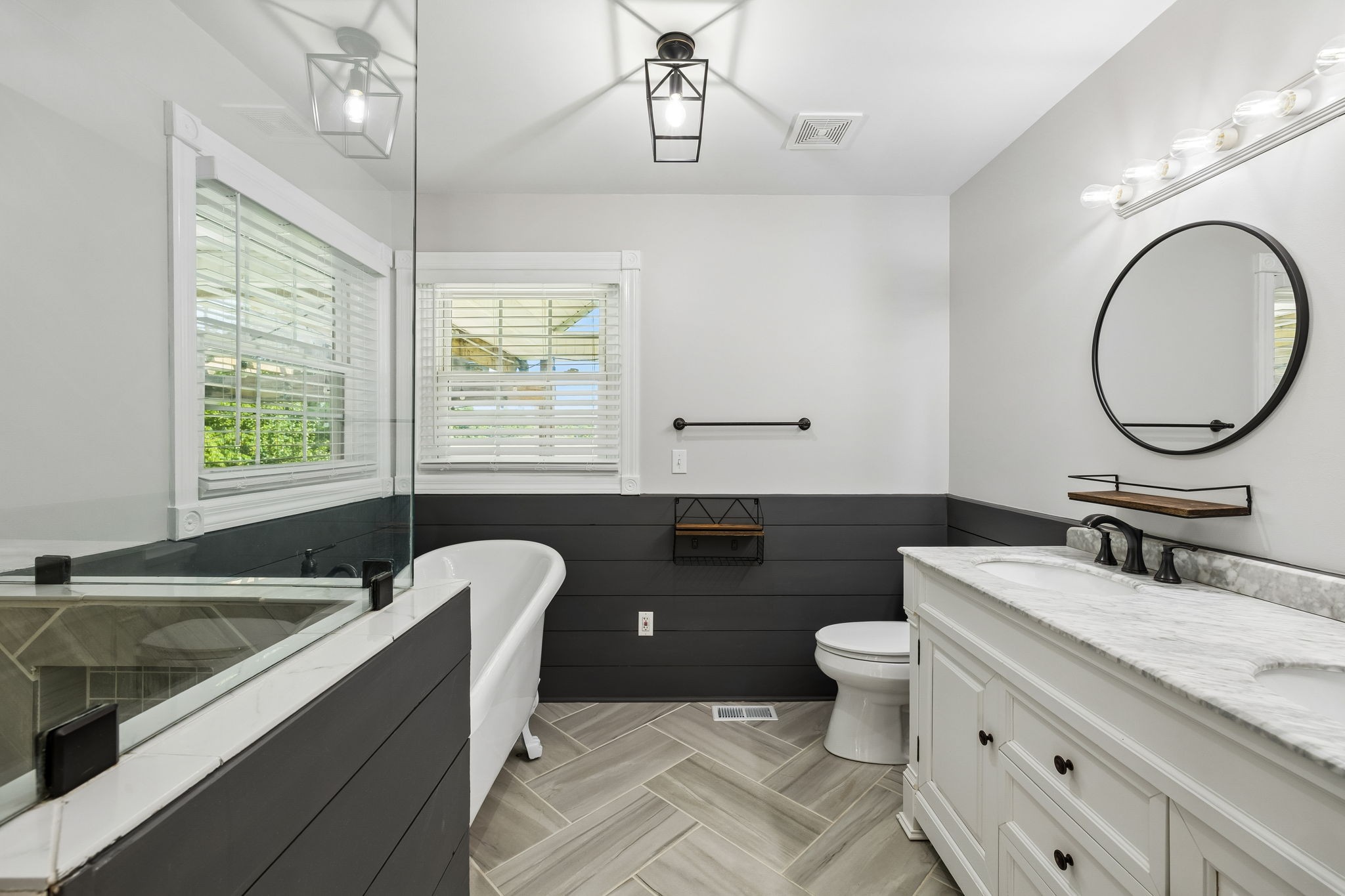 100 Heath Road Charlotte, TN 37036 - Photo 26 of 42 a bathroom with a granite countertop toilet a sink and a mirror