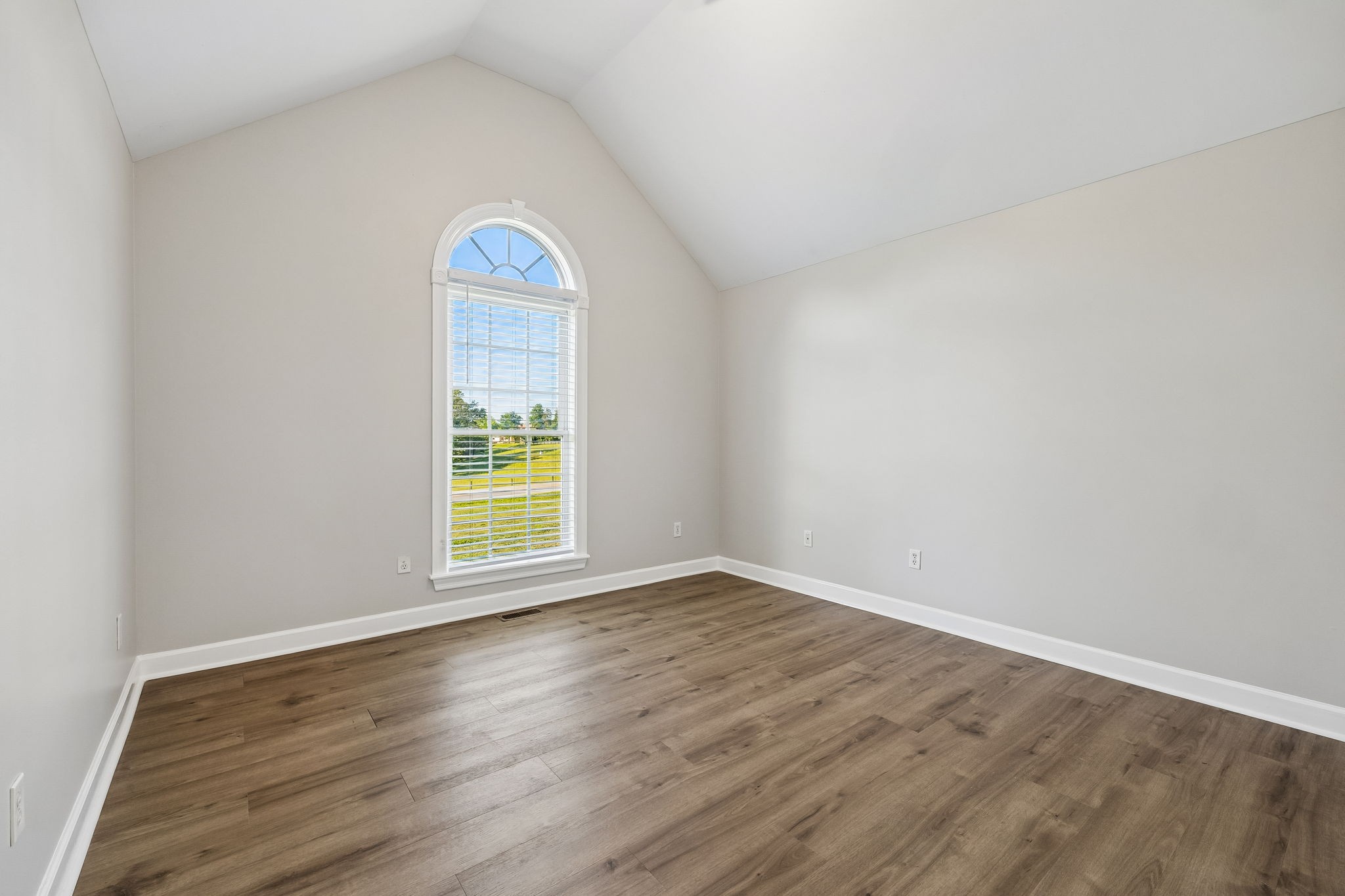 100 Heath Road Charlotte, TN 37036 - Photo 28 of 42 a view of an empty room with wooden floor and a window