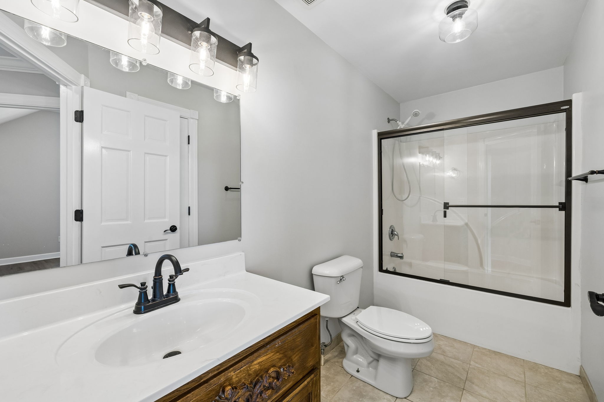 100 Heath Road Charlotte, TN 37036 - Photo 29 of 42 a bathroom with a sink toilet and shower