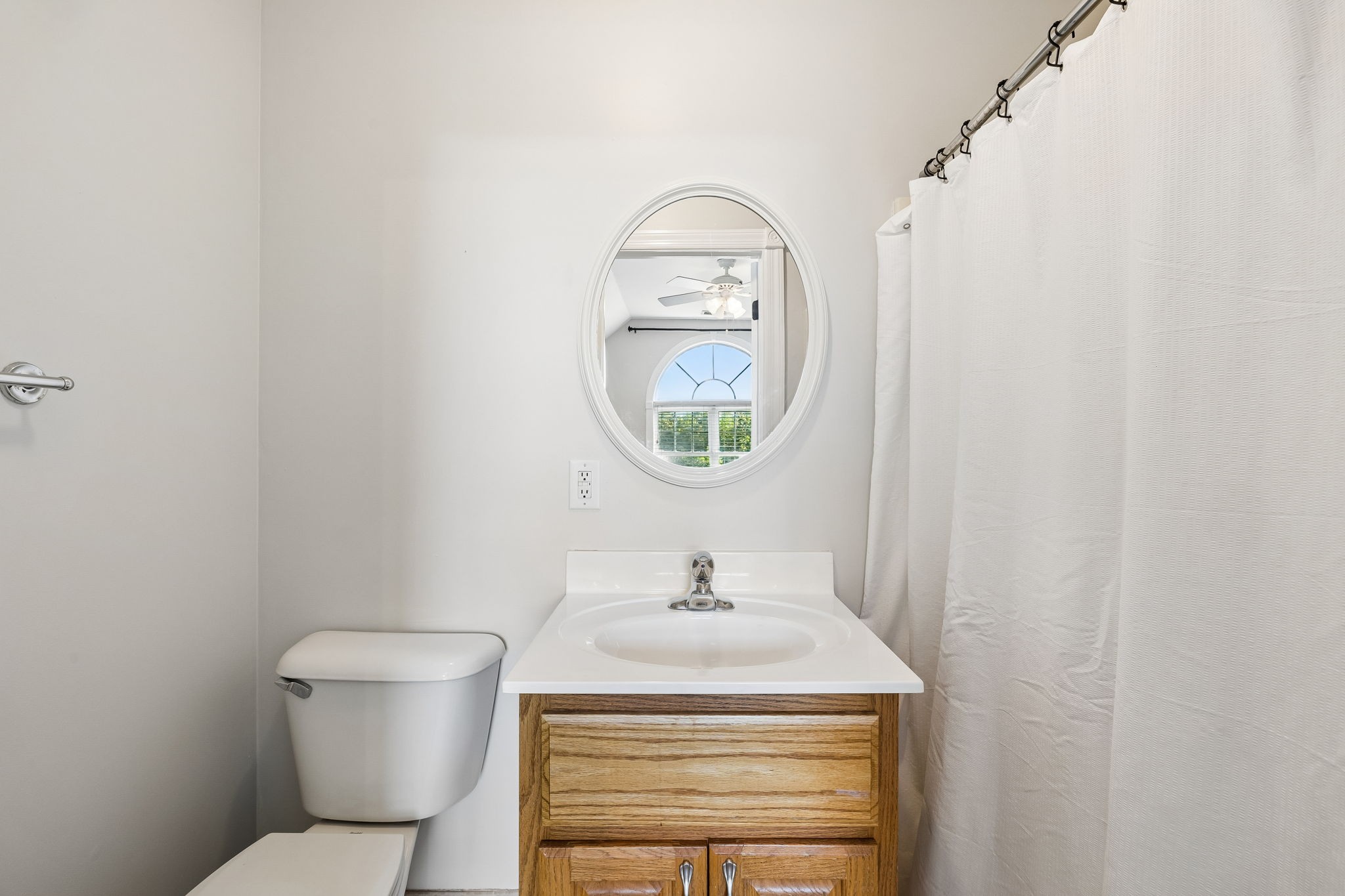 100 Heath Road Charlotte, TN 37036 - Photo 35 of 42 a bathroom with a toilet a sink and mirror