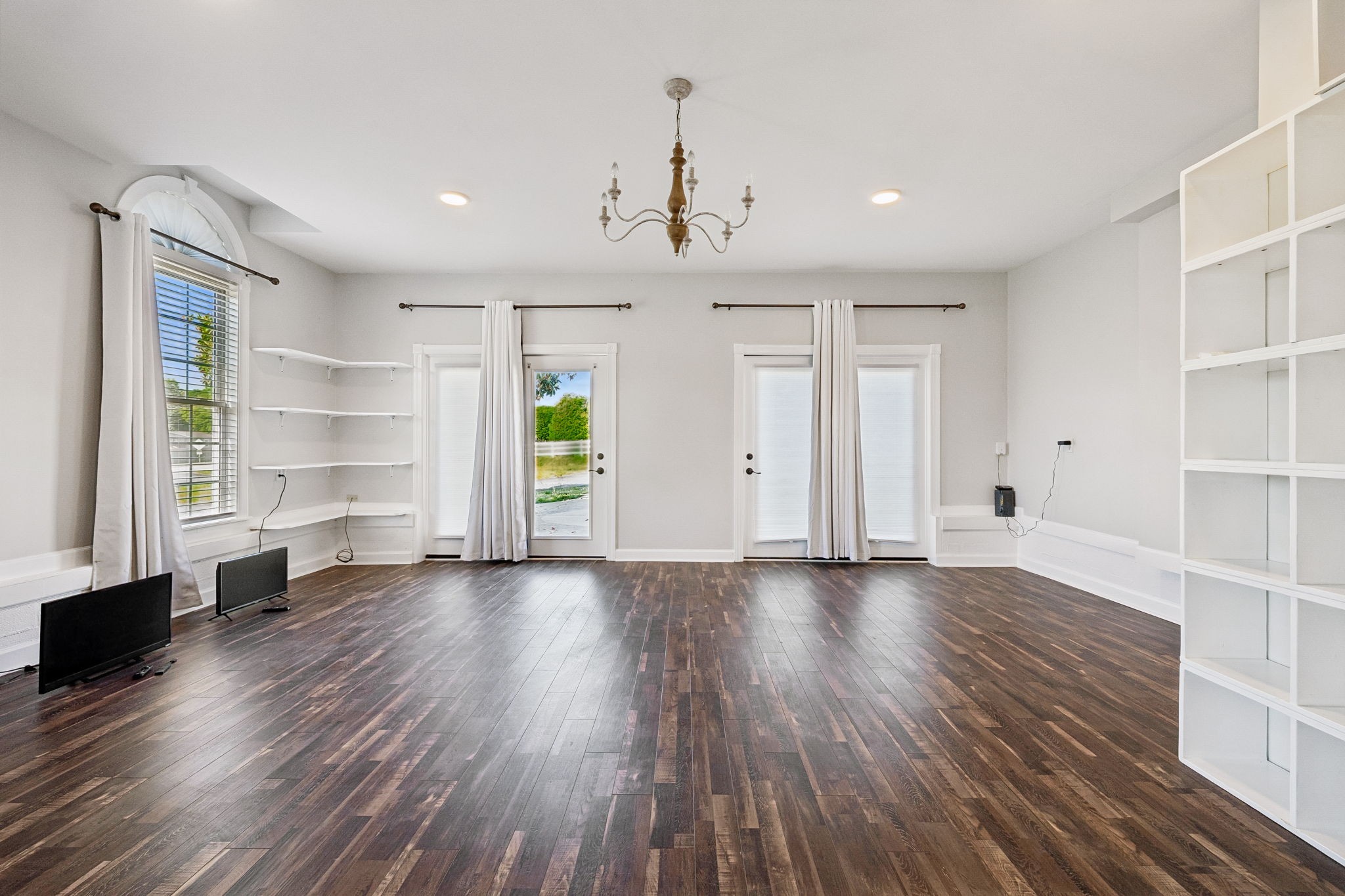 100 Heath Road Charlotte, TN 37036 - Photo 37 of 42 an empty room with wooden floor cabinet and windows