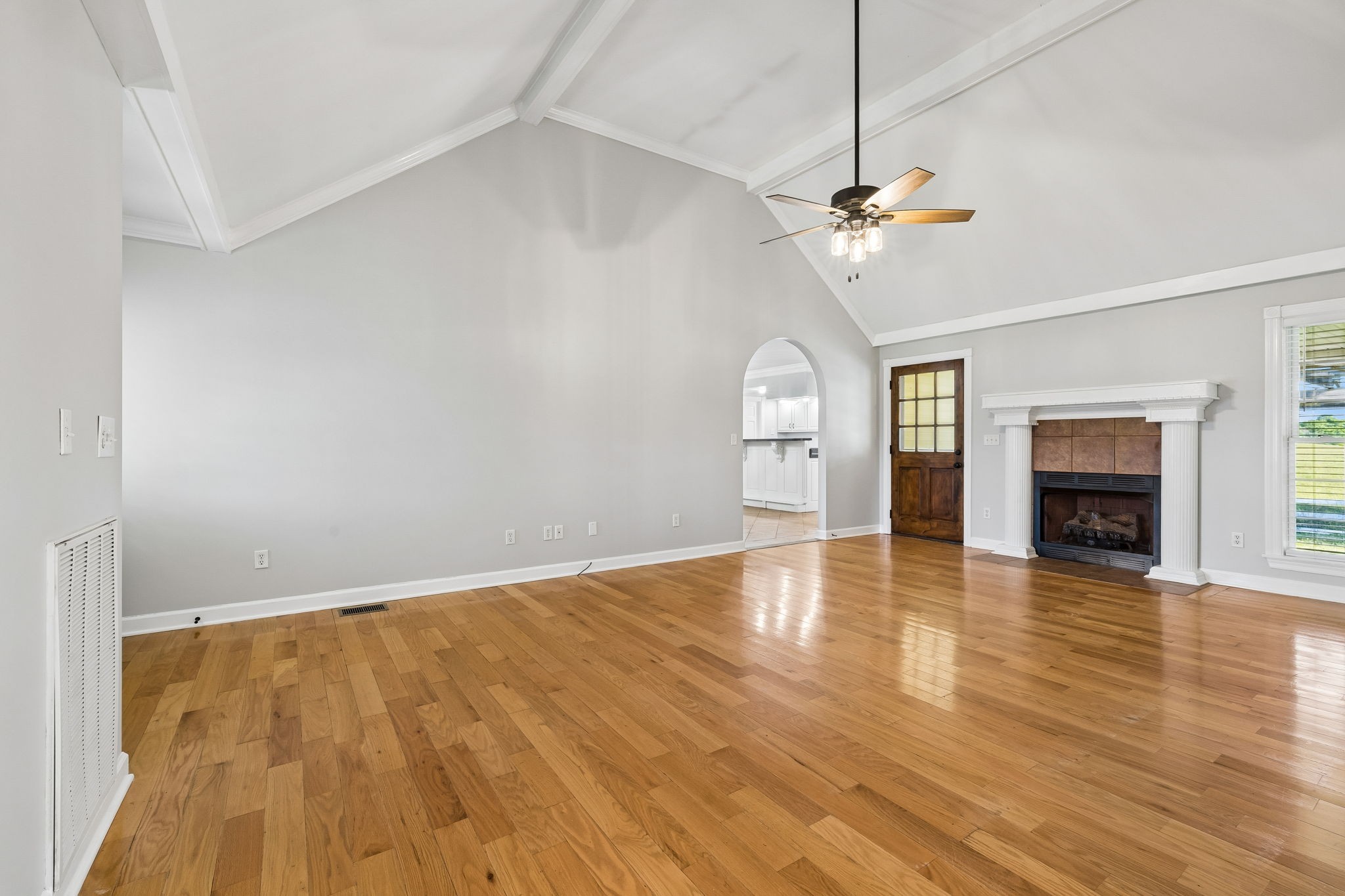 100 Heath Road Charlotte, TN 37036 - Photo 8 of 42 a view of empty room with wooden floor and fireplace