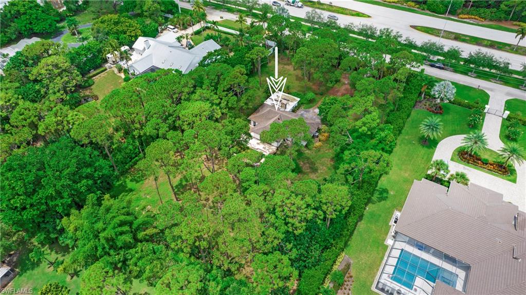 6640 Trail Boulevard Naples, FL 34108 - Photo 19 of 25 an aerial view of a house with a yard