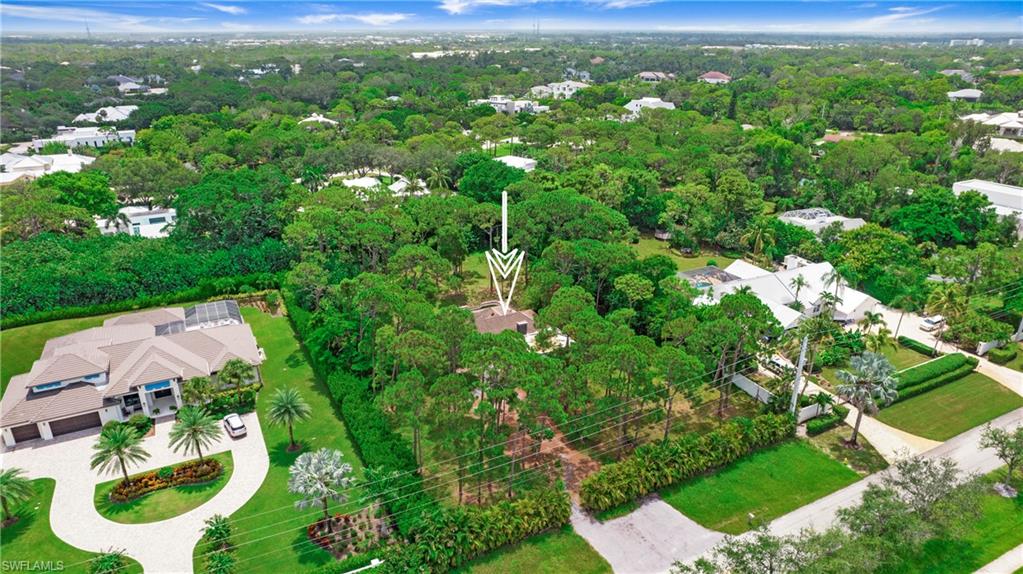 6640 Trail Boulevard Naples, FL 34108 - Photo 20 of 25 an aerial view of residential houses with outdoor space and trees
