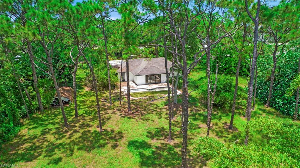 6640 Trail Boulevard Naples, FL 34108 - Photo 4 of 25 an aerial view of a house with a yard