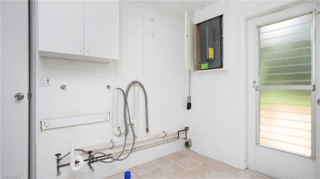 6640 Trail Boulevard Naples, FL 34108 - Photo 9 of 25 a bathroom with a bathtub and shower