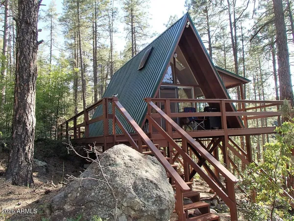 a view of house with trees in the background