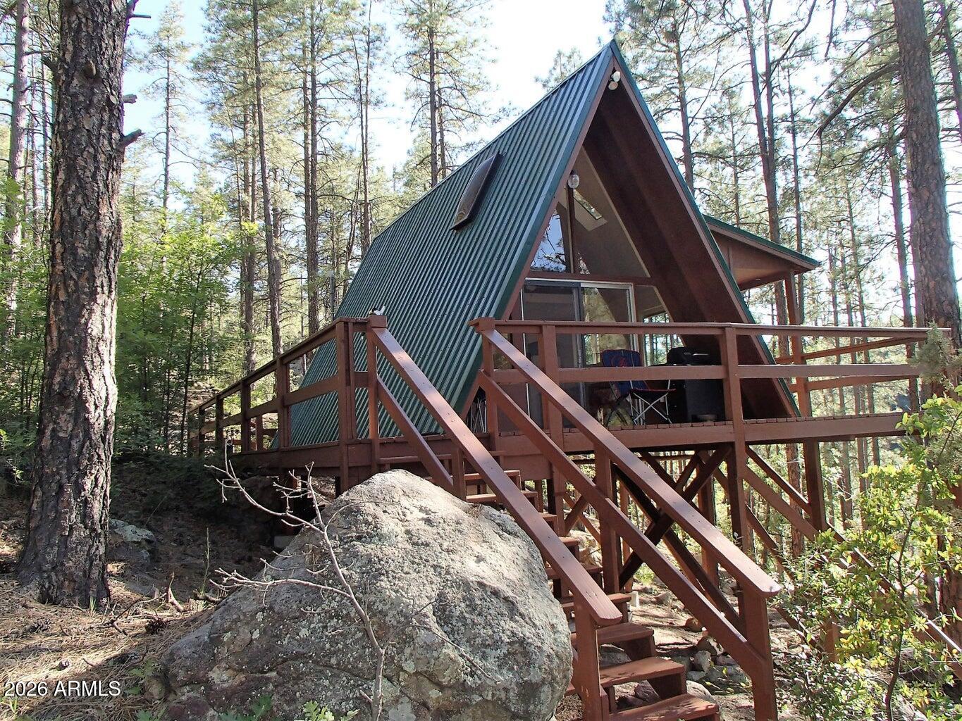 a view of house with trees in the background