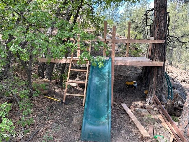 7345 Crown King Road Crown King, AZ 86343 - Photo 13 of 22 a backyard of a house with table and chairs
