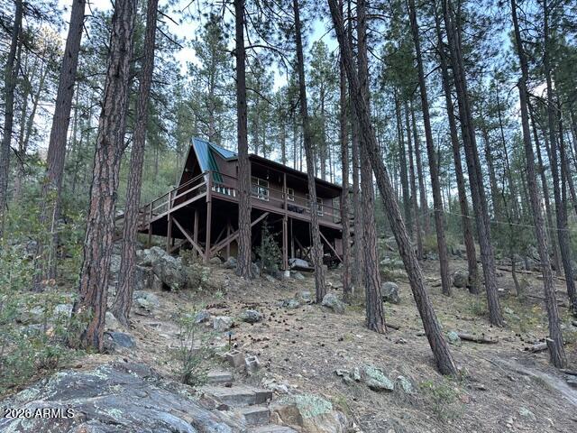 7345 Crown King Road Crown King, AZ 86343 - Photo 20 of 22 a view of a house with a yard and sitting area