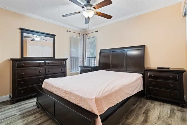 a bedroom with a bed and a dresser