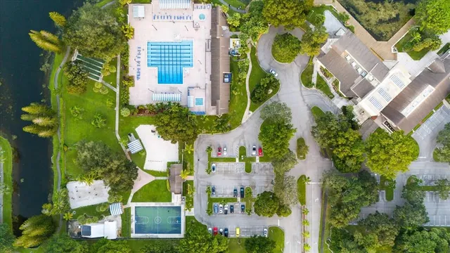 an aerial view of residential houses with outdoor space and street view