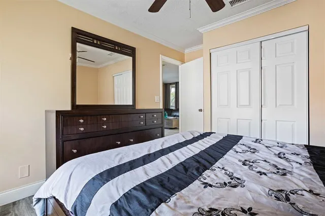 a bedroom with a bed and a closet