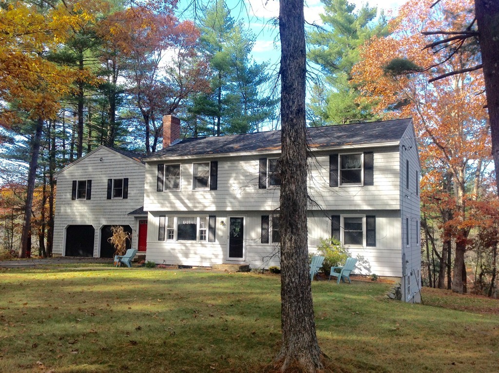 99 Keyes Road Westford, MA 01886 - Photo 2 of 20 a front view of a house with a garden