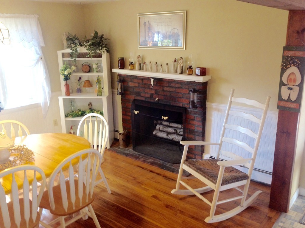 99 Keyes Road Westford, MA 01886 - Photo 5 of 20 a living room with hard wood flooring and a fireplace