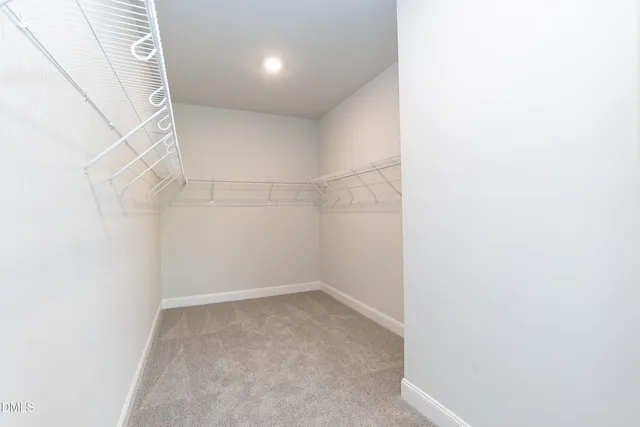 a view of a hallway with windows