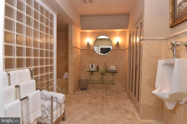 a spacious bedroom with a bed and furniture