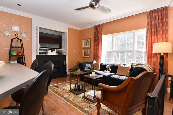 a living room with fireplace furniture and a flat screen tv