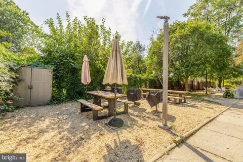 a view of a backyard with sitting area